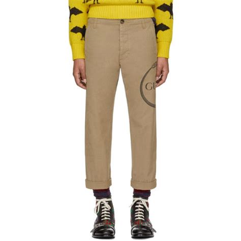 gucci beige ouroboros logo chinos|Gucci Ouroboros Print Chino Trousers .